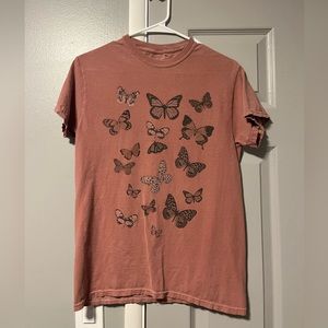 Light pink tee shirt with butterfly’s